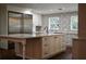 Bright kitchen with white cabinets, large island, and stainless steel appliances at 6255 Mercantile Ln, Fort Meade, FL 33841