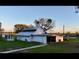 White outbuilding with garage door and large yard at 6255 Mercantile Ln, Fort Meade, FL 33841