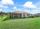 House with large backyard and green lawn at 6267 Se 13Th St, Ocala, FL 34472