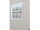 Window with blinds showcasing a view of neighboring houses at 6267 Se 13Th St, Ocala, FL 34472