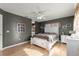 Serene bedroom with white bed frame and hardwood floors at 6490 Sw 84Th St, Ocala, FL 34476