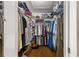 Walk-in closet with ample shelving and hanging space at 6490 Sw 84Th St, Ocala, FL 34476