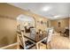 Bright dining room with a farmhouse table and access to the living room at 6490 Sw 84Th St, Ocala, FL 34476