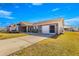 House exterior with driveway and landscaping at 6490 Sw 84Th St, Ocala, FL 34476