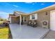 Inviting front porch with rocking chairs, perfect for relaxing at 6490 Sw 84Th St, Ocala, FL 34476