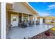 Spacious front porch features rocking chairs and a welcoming entryway at 6490 Sw 84Th St, Ocala, FL 34476