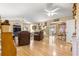 Spacious living room featuring hardwood floors and an open floor plan at 6490 Sw 84Th St, Ocala, FL 34476