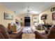 Relaxing living room, featuring two sofas and a large TV at 6490 Sw 84Th St, Ocala, FL 34476