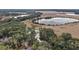 Aerial view of property near lake and road at 6555 Se 165Th Ave, Ocklawaha, FL 32179