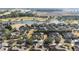 Aerial view of homes near a golf course and lake at 6767 Sw 91St Cir, Ocala, FL 34481