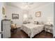 Guest bedroom with hardwood floors and ceiling fan at 6767 Sw 91St Cir, Ocala, FL 34481