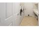 Laundry room with washer, dryer, sink, and additional storage at 6767 Sw 91St Cir, Ocala, FL 34481