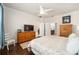 Main bedroom with hardwood floors and built-in dresser at 6767 Sw 91St Cir, Ocala, FL 34481