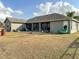 Ranch style home with a screened porch and large backyard at 7045 Greengrove Blvd, Clermont, FL 34714