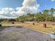 Large backyard with fire pit and equestrian area at 7045 Greengrove Blvd, Clermont, FL 34714