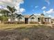 One-story home with a landscaped yard at 7045 Greengrove Blvd, Clermont, FL 34714