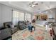 Living area with open concept to kitchen at 7045 Greengrove Blvd, Clermont, FL 34714