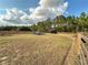 Pasture with a shelter and feeding area for livestock at 7045 Greengrove Blvd, Clermont, FL 34714