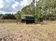 Hay feeder in a pasture with wooden fence at 7045 Greengrove Blvd, Clermont, FL 34714