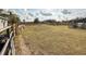 Horse in a large pasture with a wooden fence at 7045 Greengrove Blvd, Clermont, FL 34714