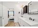 Main bathroom with double vanity and a view of bedroom at 7865 Sw 89Th Cir, Ocala, FL 34481