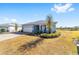 One-story home with light gray siding, paver driveway, and landscaped yard at 7865 Sw 89Th Cir, Ocala, FL 34481