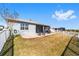 Back exterior of house showing patio and fenced yard at 7865 Sw 89Th Cir, Ocala, FL 34481