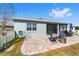 Back exterior view of house with patio, screened lanai, and fenced yard at 7865 Sw 89Th Cir, Ocala, FL 34481