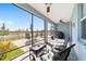 Relaxing screened porch with wicker furniture and ceiling fan at 7865 Sw 89Th Cir, Ocala, FL 34481