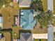 Bird's eye view showing a home's roof, patio, and landscaping at 8594 Sw 61St Ct, Ocala, FL 34476