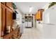 Well-lit laundry room with washer, dryer, and cabinets at 8594 Sw 61St Ct, Ocala, FL 34476