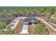 New home construction aerial view showcasing a single-story home with driveway at 8786 Sw 127 Ave, Dunnellon, FL 34432