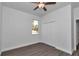 Bright bedroom with ceiling fan, hardwood floors, and double closet at 8786 Sw 127 Ave, Dunnellon, FL 34432