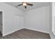 Spacious bedroom with wood-look floors and double door closet at 8786 Sw 127 Ave, Dunnellon, FL 34432