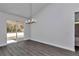 Bright dining room with hardwood floors and sliding glass doors at 8786 Sw 127 Ave, Dunnellon, FL 34432