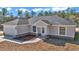 Newly built home, light beige with stone accents and gray roof at 8786 Sw 127 Ave, Dunnellon, FL 34432