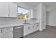 White cabinets and stainless steel appliances feature in this kitchen at 8786 Sw 127 Ave, Dunnellon, FL 34432