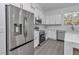 Stainless steel appliances and white cabinets highlight this kitchen at 8786 Sw 127 Ave, Dunnellon, FL 34432