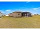 Beautiful backyard view with a screened-in patio and manicured landscaping at 8902 Sw 75Th Loop, Ocala, FL 34481