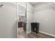 Laundry area with a utility sink and access to the kitchen through an open doorway at 8902 Sw 75Th Loop, Ocala, FL 34481