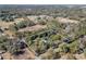 An aerial view outlines the perimeter of the property with mature landscaping at 9352 Ne 27Th Ter, Anthony, FL 32617