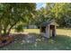 Expansive backyard with outbuilding, utility shed and mature trees at 9352 Ne 27Th Ter, Anthony, FL 32617