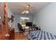 Traditional bedroom with hardwood floors, ceiling fan, and natural light from the window at 9352 Ne 27Th Ter, Anthony, FL 32617