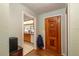 The hallway leads into the kitchen with wooden cabinets and tile countertops at 9352 Ne 27Th Ter, Anthony, FL 32617