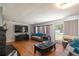 Relaxing living room with hardwood floors, a fireplace and sliding glass doors at 9352 Ne 27Th Ter, Anthony, FL 32617