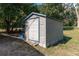 Exterior view of a shed with a single door, providing additional storage space on the property at 9352 Ne 27Th Ter, Anthony, FL 32617