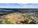 Overhead shot of the golf course community, highlighting the expansive green space, natural beauty, and ideal home locations at 9651 Se 137Th Street Rd, Summerfield, FL 34491