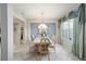 Elegant dining room featuring tile flooring, ornate furniture, and lots of natural light at 9651 Se 137Th Street Rd, Summerfield, FL 34491