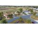 Beautiful single Gathering homes with mature landscaping, paver driveways, and lush green golf course views at 9651 Se 137Th Street Rd, Summerfield, FL 34491