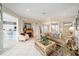 Living room with neutral decor, tile floors, fireplace, and open floor plan at 9651 Se 137Th Street Rd, Summerfield, FL 34491